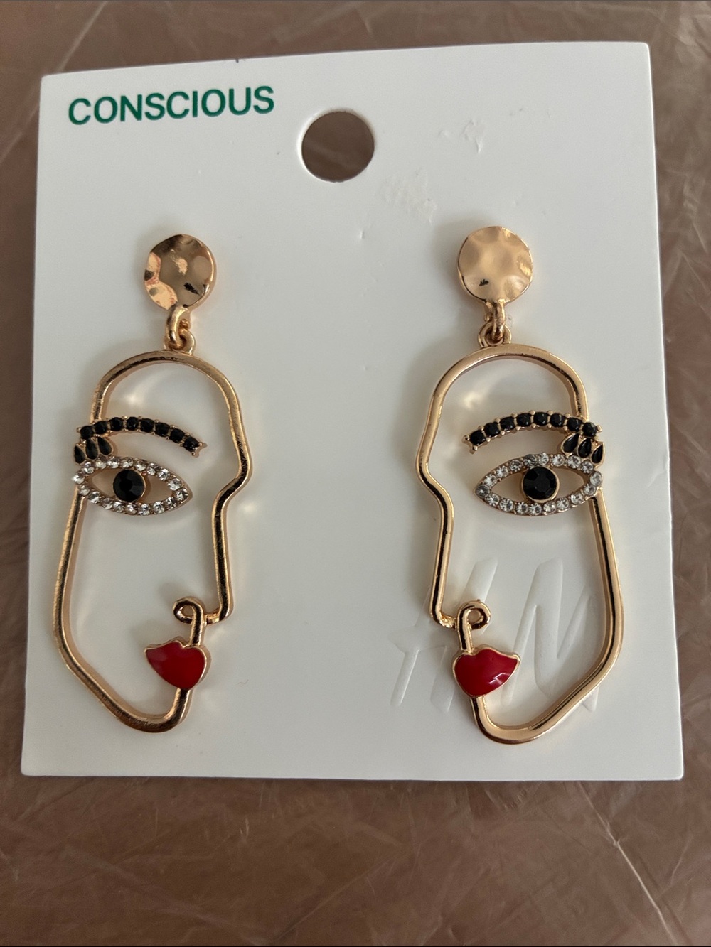 H&M Gold Face Outline Earrings with Black Eye Accents and Red Heart